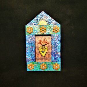 Colorful folk-art sacred heart shrine with eye