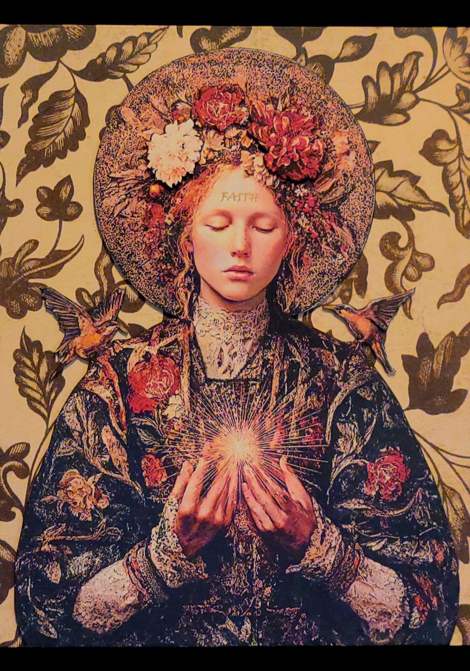 Woman with floral halo and glowing orb.